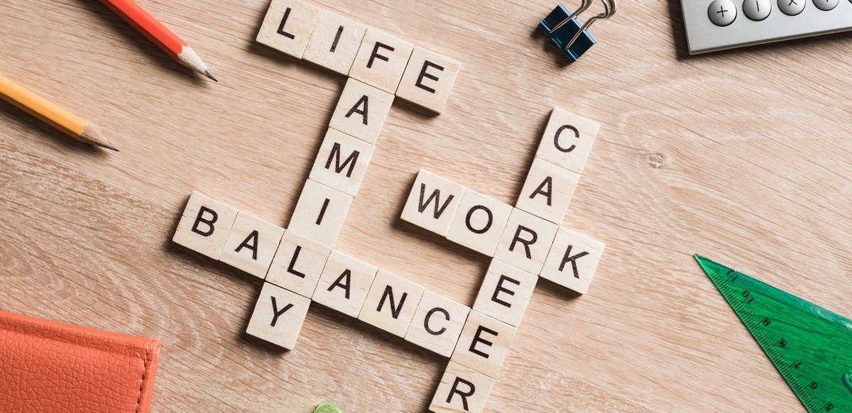 Words work life balance and family on table collected with wooden cubes